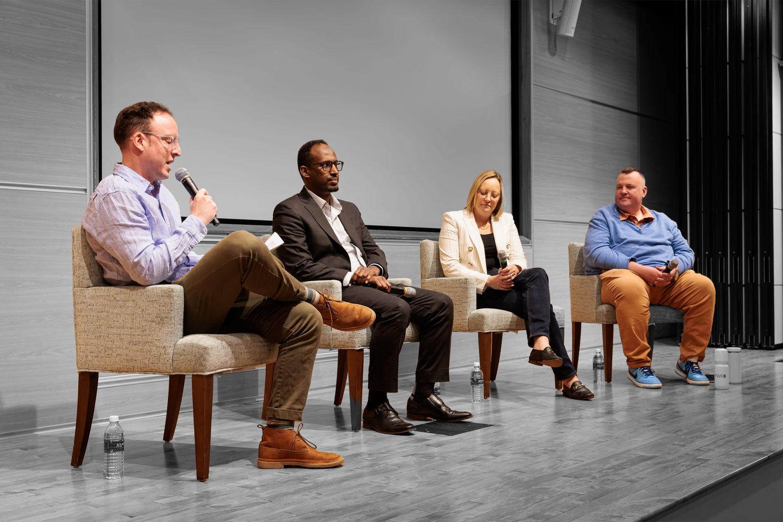 (from left) Isaac Saul moderates a panel with Mukhtar Ibrahim, Anna Palmer, and Sean McPherson at St. Olaf College | Credit: St. Olaf College, edited by Russell Nystrom