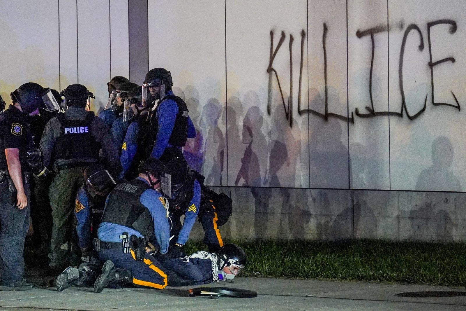 An anti-ICE protester is detained during a curfew outside Delaney Hall in Newark, New Jersey, May 31. REUTERS/Ryan Murphy