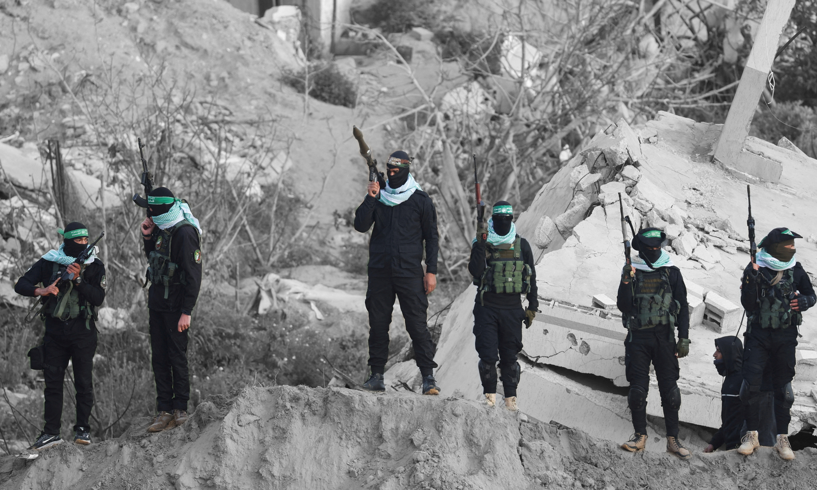 Hamas militants in the southern Gaza Strip | REUTERS/Ramadan Abed, edited by Russell Nystrom
