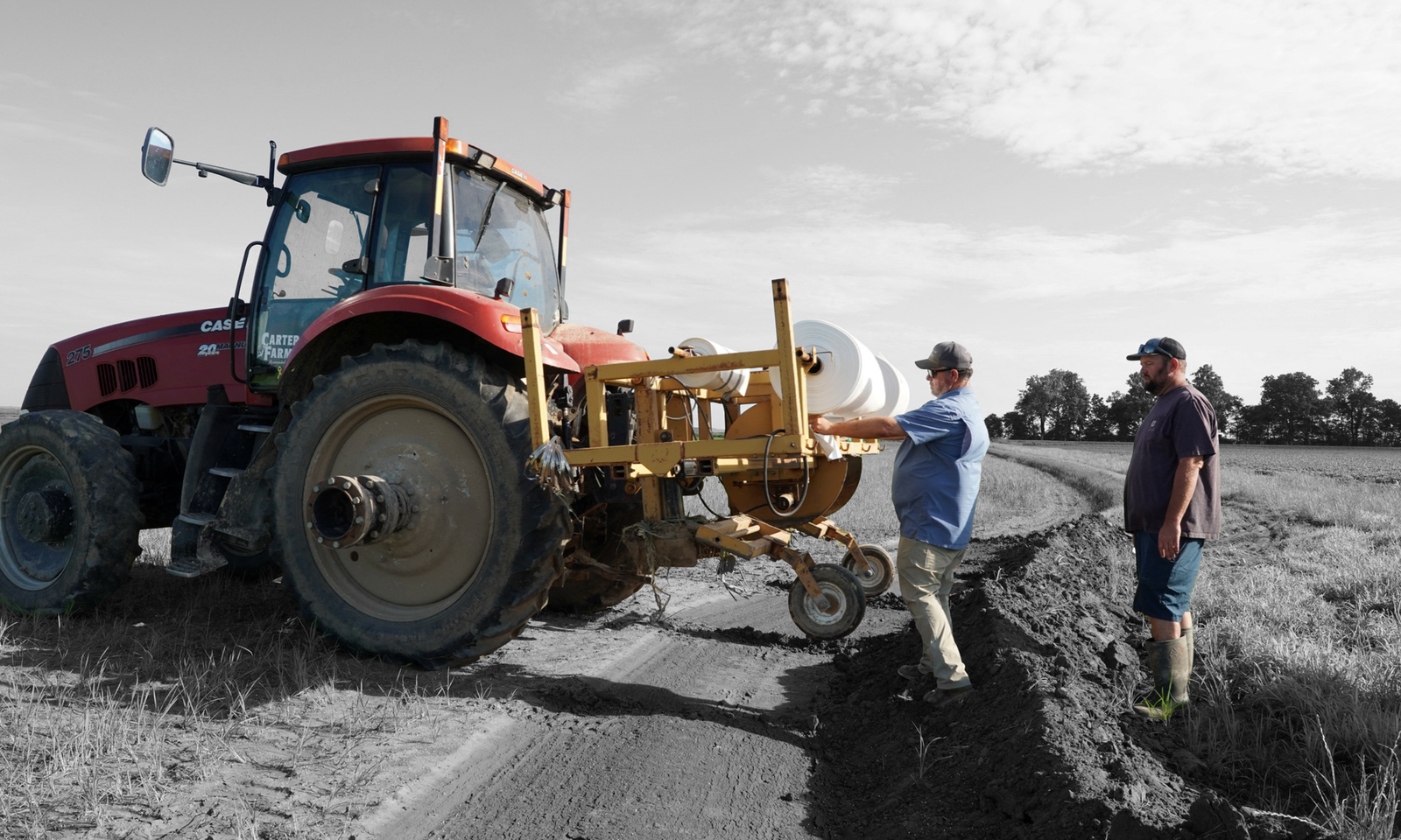 Farmer Cliff Carter works on an irrigation system for one of his rice fields in Rector, Arkansas