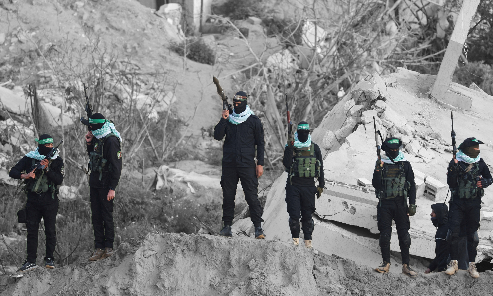 Hamas militants in the southern Gaza Strip | REUTERS/Ramadan Abed, edited by Russell Nystrom