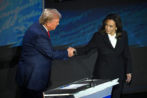 Trump and Harris shake hands before their first debate. Photo by SAUL LOEB / AFP