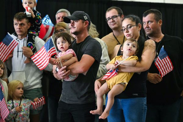 Afrikaners from South Africa listen to remarks from Deputy Secretary of State Christopher Landau on May 12 | Saul Loeb/AFP via Getty Images