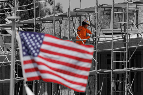 A construction worker at a multi-unit residential housing project in Encinitas, California | REUTERS/Mike Blake, edited by Russell Nystrom