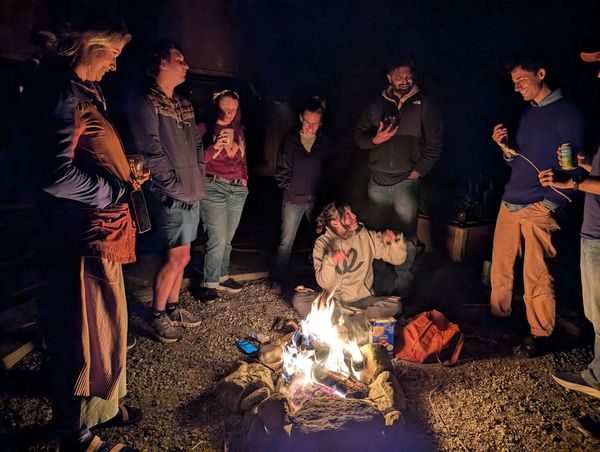The Tangle team around a campfire during a team retreat in Vermont. Photo: Ari Weitzman
