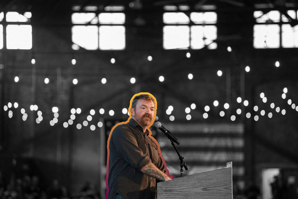 Graham Platner (D) speaks during a campaign rally in Portland, Maine | REUTERS/Amanda Sabga, edited by Aidan Gorman