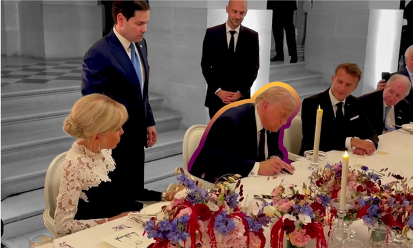 President Donald Trump signs the Iran memorandum of understanding at the Palace of Versailles.