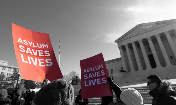 Protesters in front of the Supreme Court building ahead of arguments on denying potential asylum seekers entry to the U.S. | Bill Clark/CQ Roll Call, edited by Russell Nystrom 