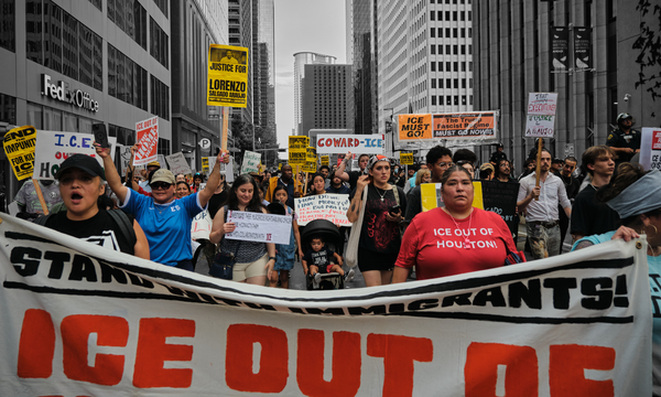 Demonstrators march in Houston following the death of a Mexican national fatally shot by a federal immigration agent | Carlos Escalona/ZUMA Press Wire, edited by Russell Nystrom
