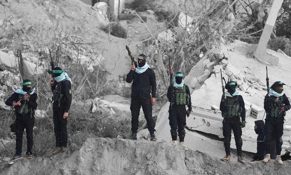 Hamas militants in the southern Gaza Strip | REUTERS/Ramadan Abed, edited by Russell Nystrom
