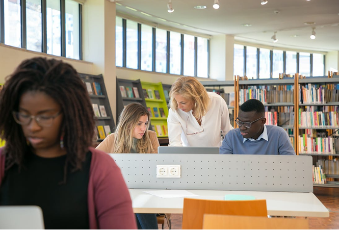 Study abroad program students in the library