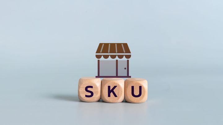 Wooden blocks with SKU text and shop icon representing inventory management, retail business, product identification, and e-commerce solutions.