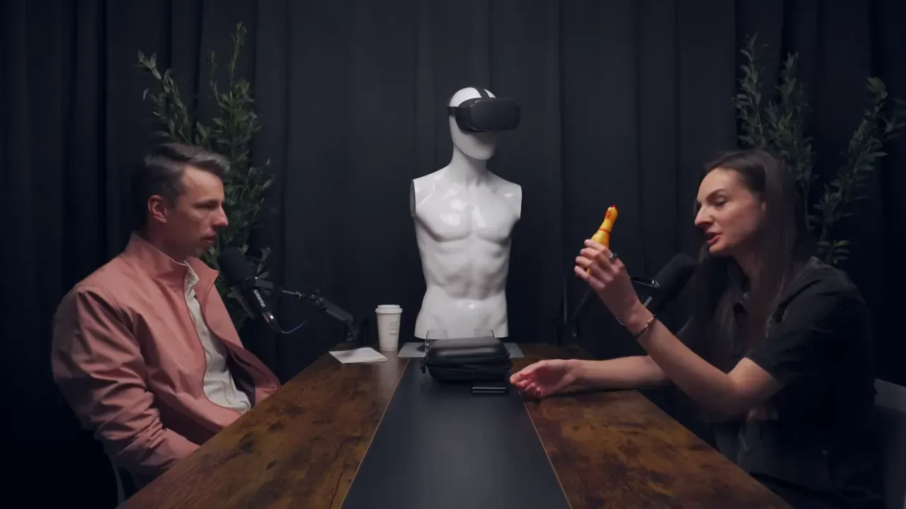 Hanna demonstrating the rubber chicken metaphor she keeps on her desk.