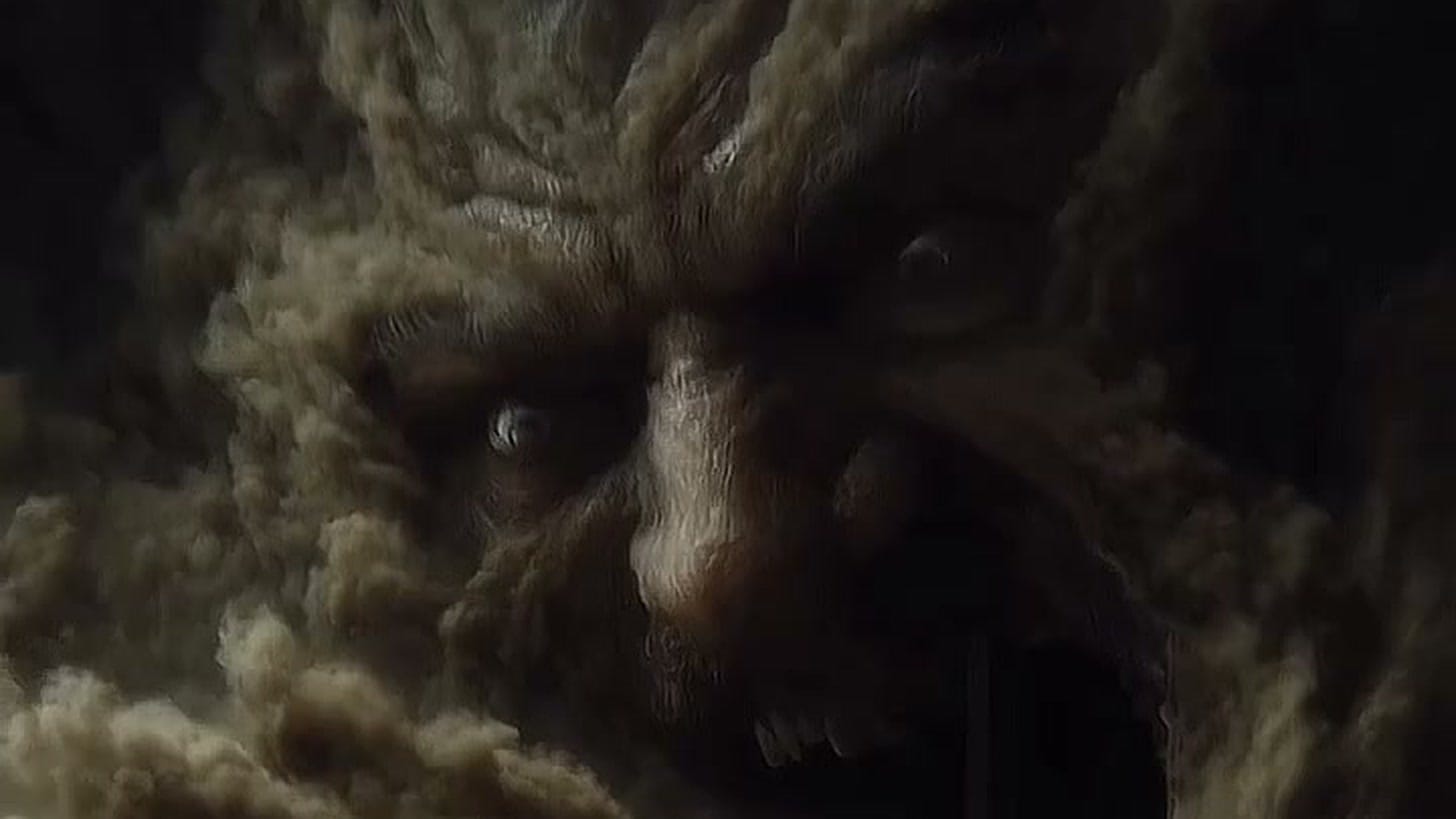 A still from dexplore.ai’s AI short film “Hades” — a colossal face forming out of clouds of dust