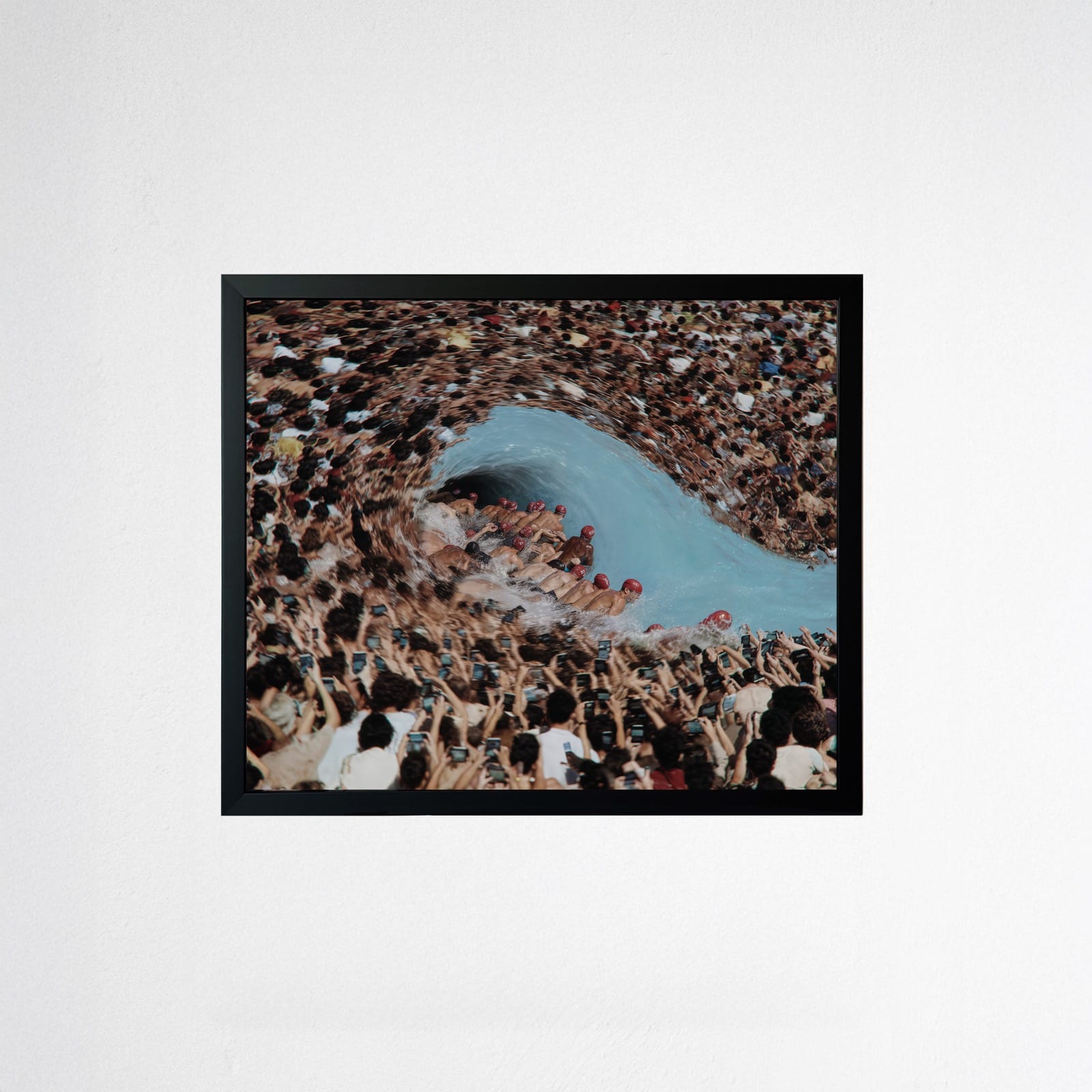 Mr. Relative's 'Spectacle' — a whirlpool formed from a massive crowd, onlookers filming on phones — framed on the wall at The Relative Gallery