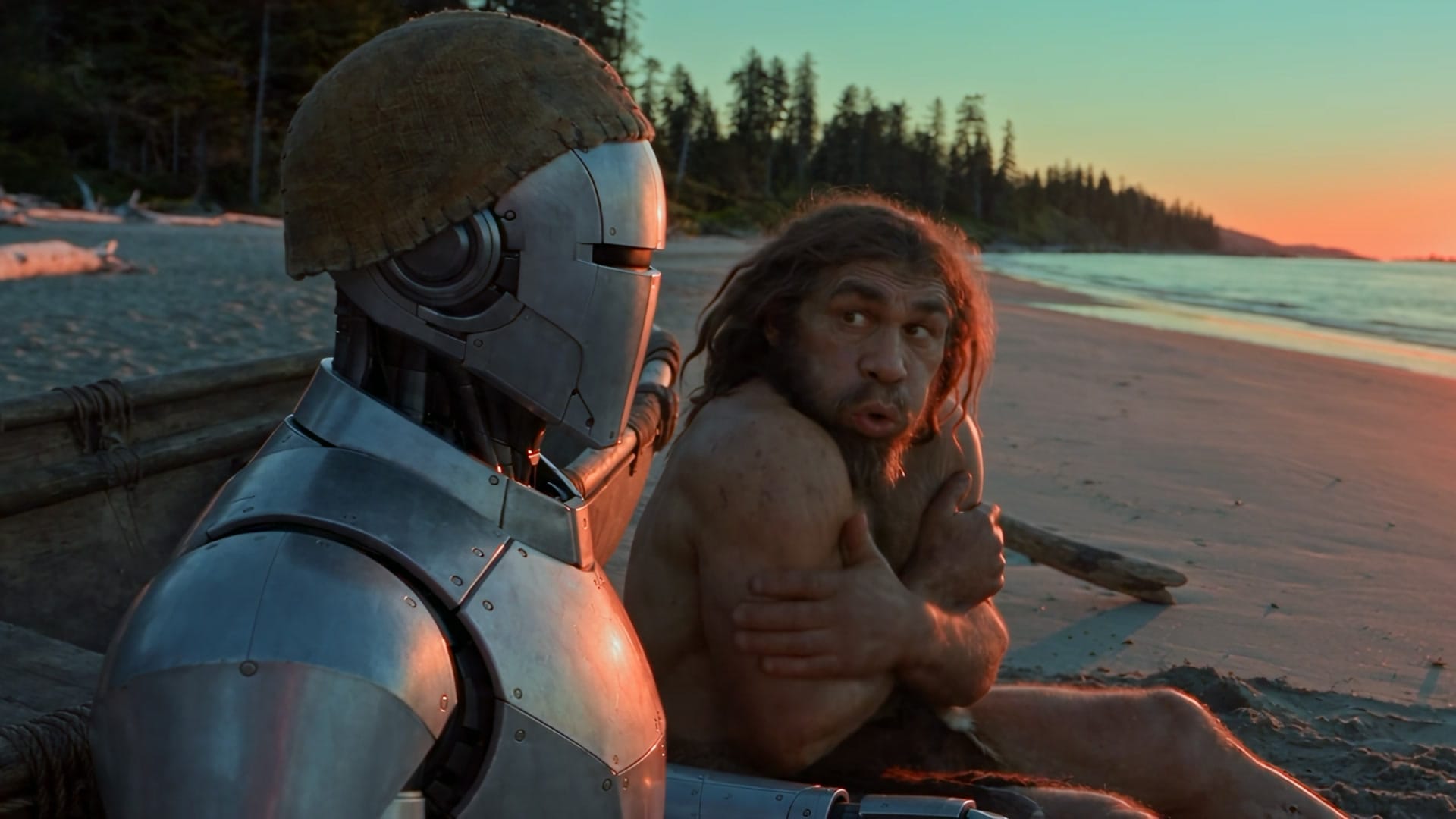 The robot wearing a stitched hide cap beside the Neanderthal on the beach at sunset
