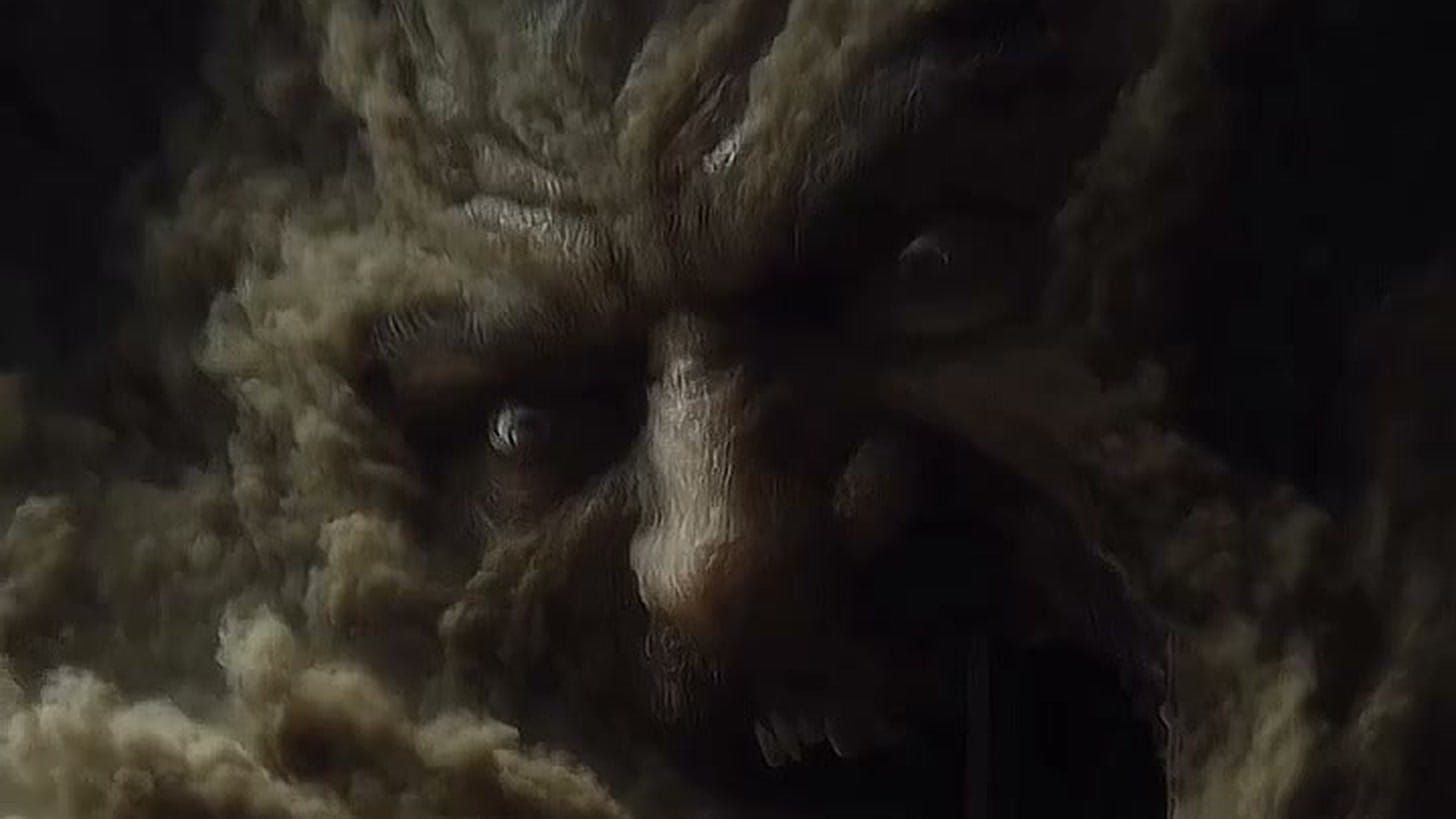 A still from dexplore.ai’s AI short film “Hades” — a colossal face forming out of clouds of dust