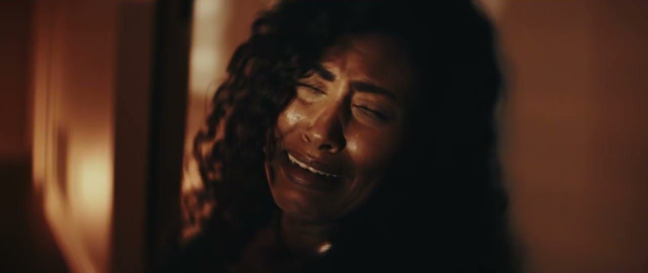 Singer-songwriter Xania Monet creating music in a studio using AI music generation tools on a laptop