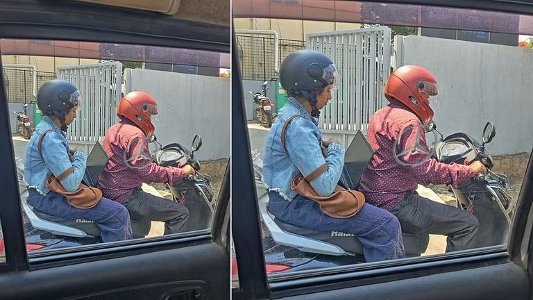 ട്രാഫിക് ബ്ലോക്കിനിടയിൽ ലാപ്ടോപ്പിൽ ജോലി ചെയ്യുന്ന യുവതി: ചിത്രം ശ്രദ്ധനേടുന്നു