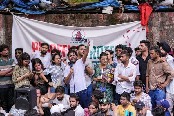 CJP Founder Abhijeet Dipke Demands Education Minister’s Resignation at Jantar Mantar Writing