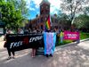 Activists gather outside Coconino County Superior Court in Flagstaff, holding signs supporting Epona Rose, a transgender woman facing felony charges after defending herself.