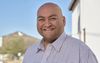 An image of former state Rep. Daniel Hernandez, smiling at a camera in front of a desert background.