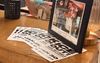 Flyers reading “ICE Out of Phoenix!” on a table beside a framed photo at Title 9 Sports Bar.