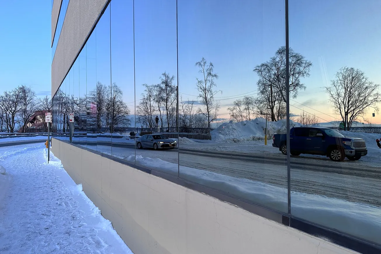Captain Cook Statute in Resolution Park, Reflected in Windows of the Brady Building, Anchorage, AK
