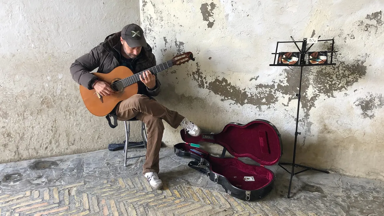 Photo of a Street Guitarist at Real Alcázar, Seville, Spain [Frederick Lane, 2019]
