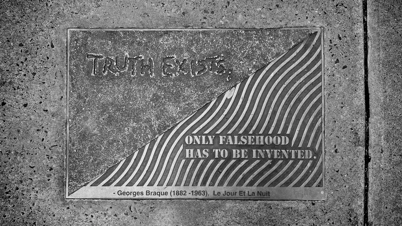 Photo of a bronze plaque with a quote from Georges Braque: "Truth Exists. Only Falsehood Has to Be Invented." Library Way, Manhattan, NY [Frederick Lane, 2021]