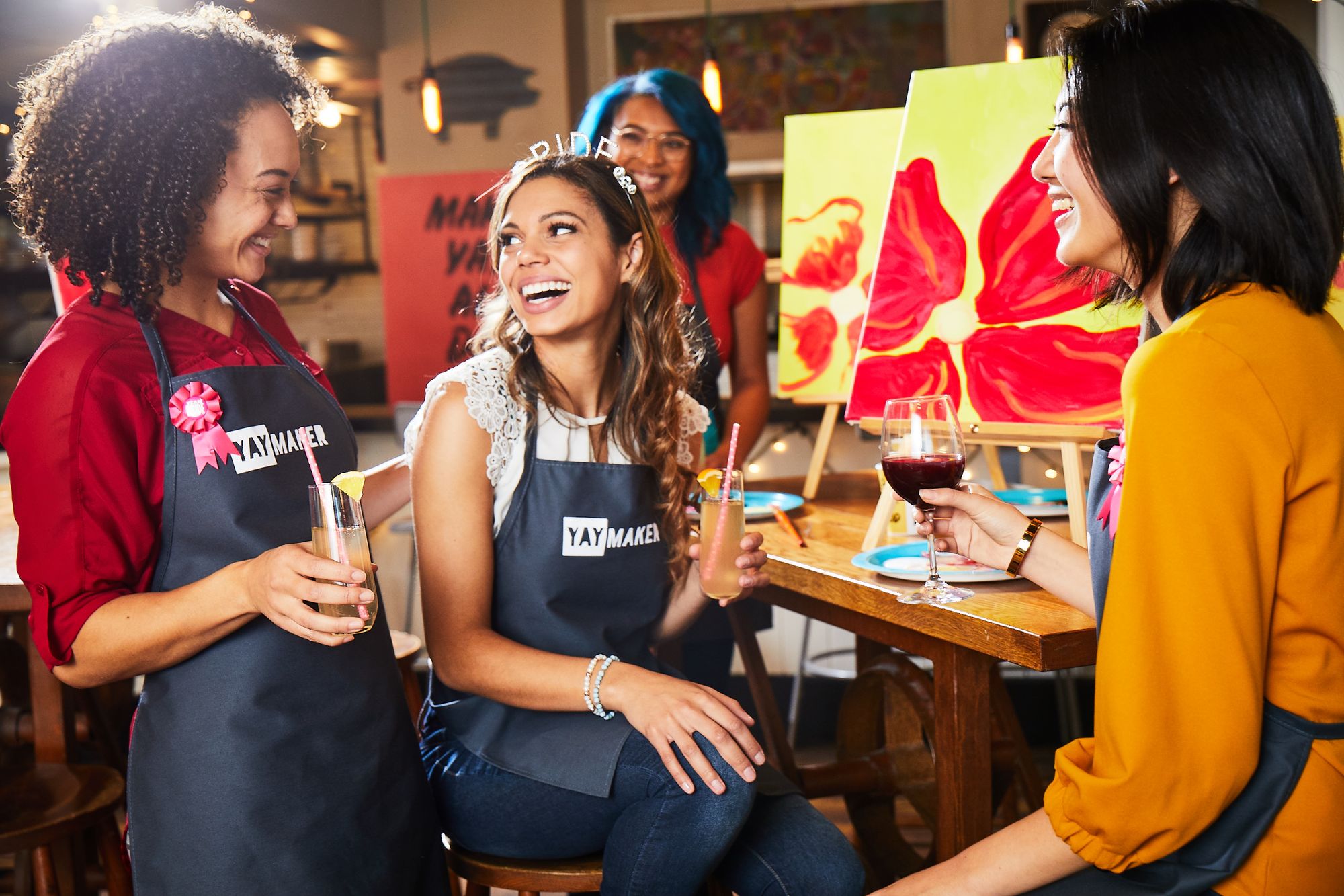 A group of friends at a Paint Nite bachelorette party