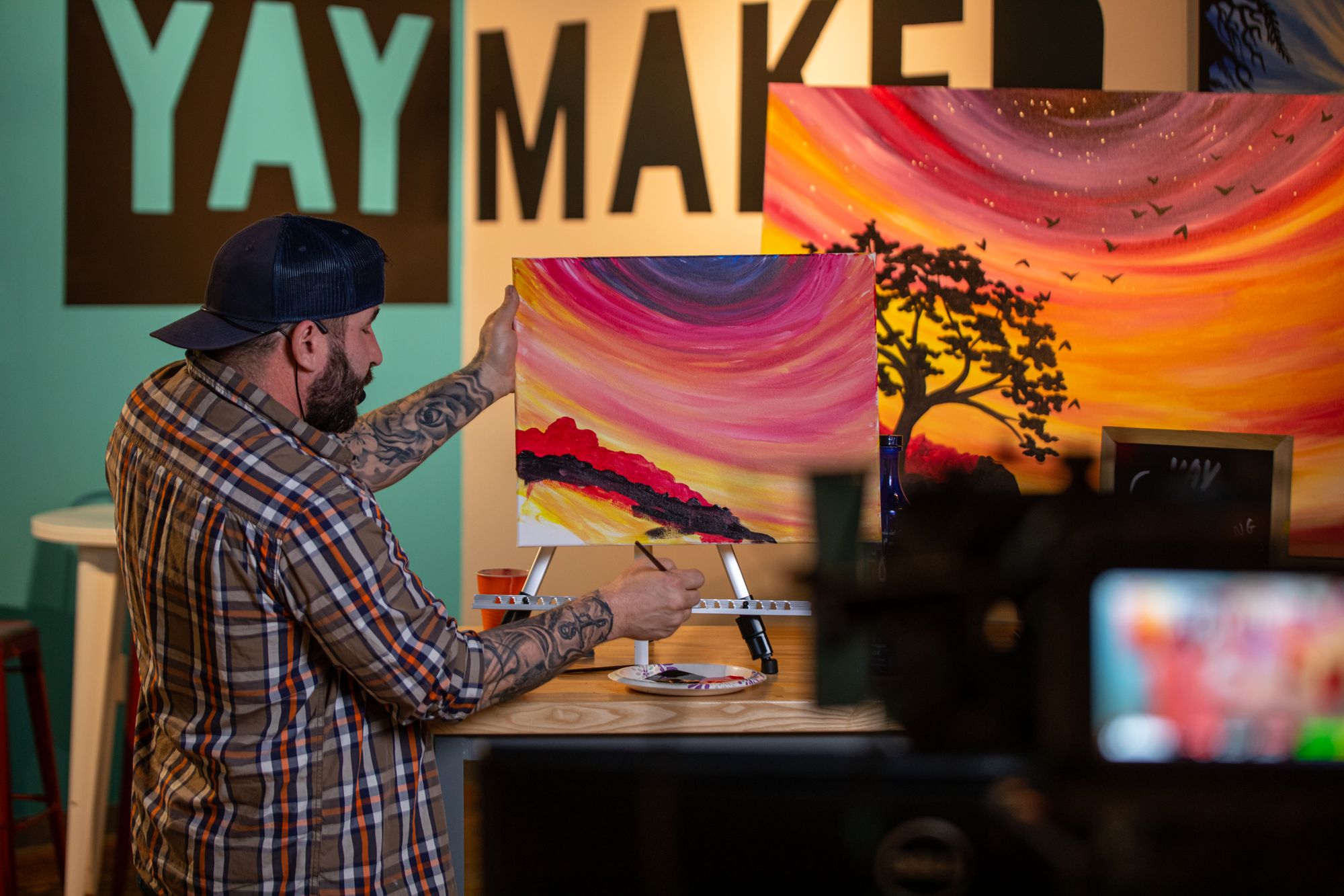 Male artist running a virtual Paint Nite event