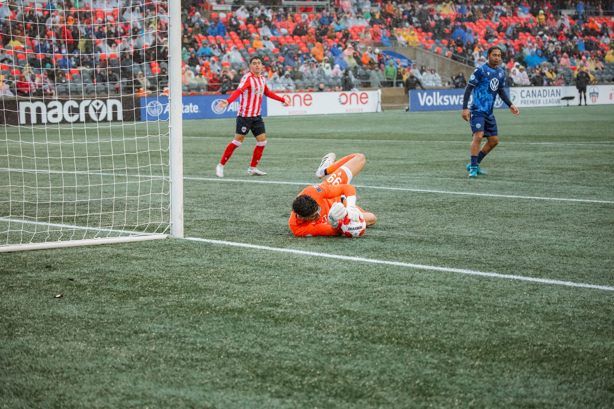 Halifax Wanderers goalkeeper Rayane Yesli makes a diving save.