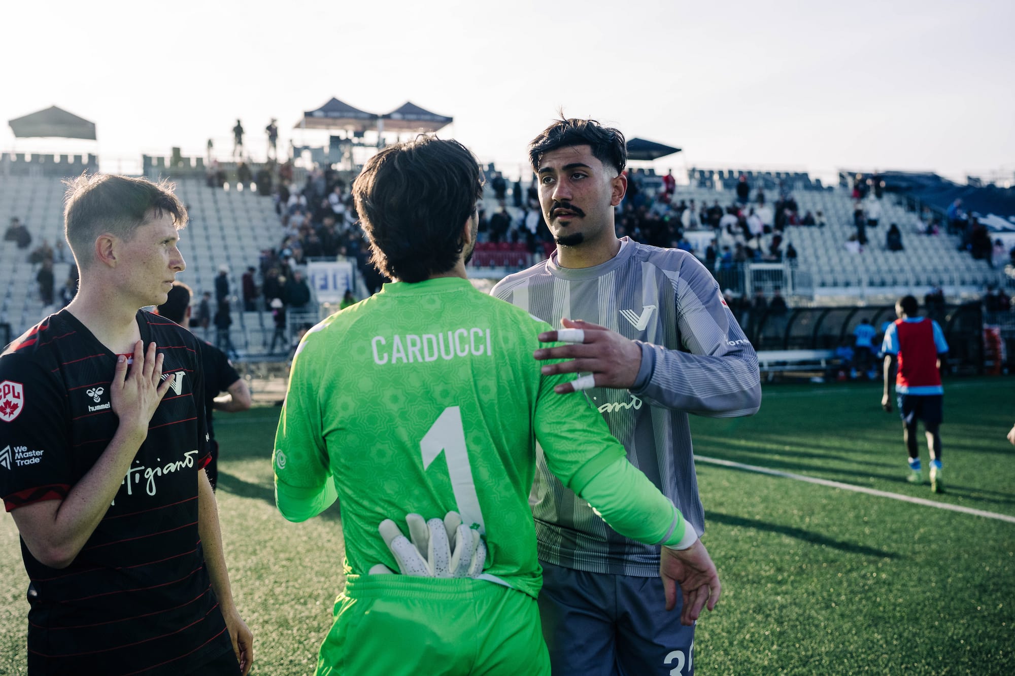 Marco Carducci chats with Matheus de Souza after the Halifax Wanderers' match against Vancouver FC.