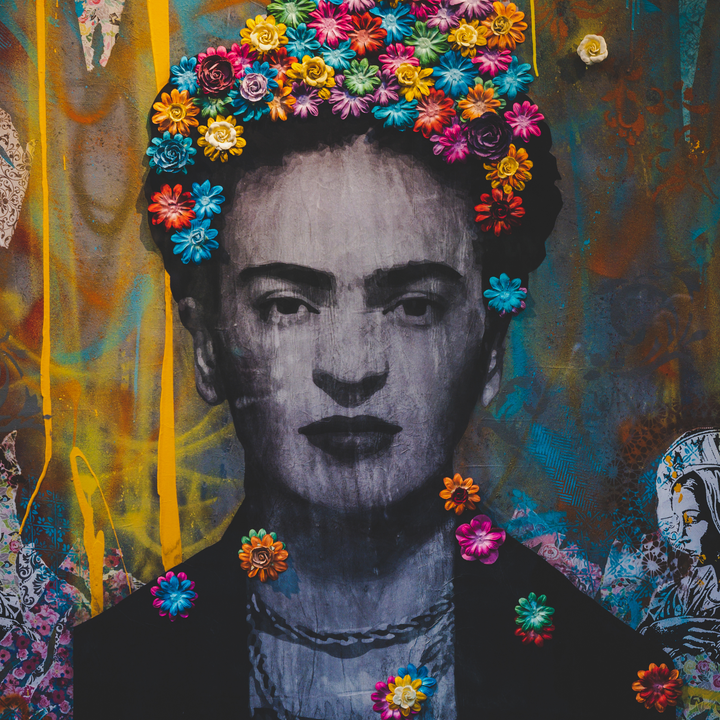 A photo of street art depicting the Mexican painter Frida Kahlo.