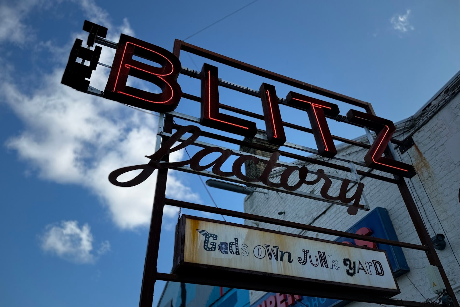 Neon sign of Gods own junkyard