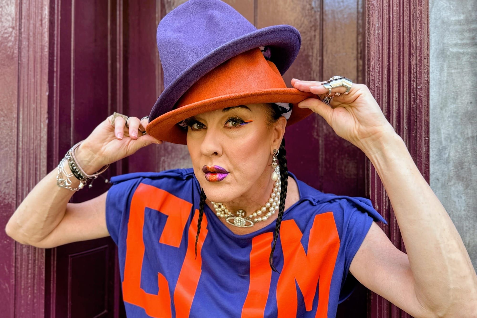 Image of New Romance icon Maur Valance wearing signature double hats