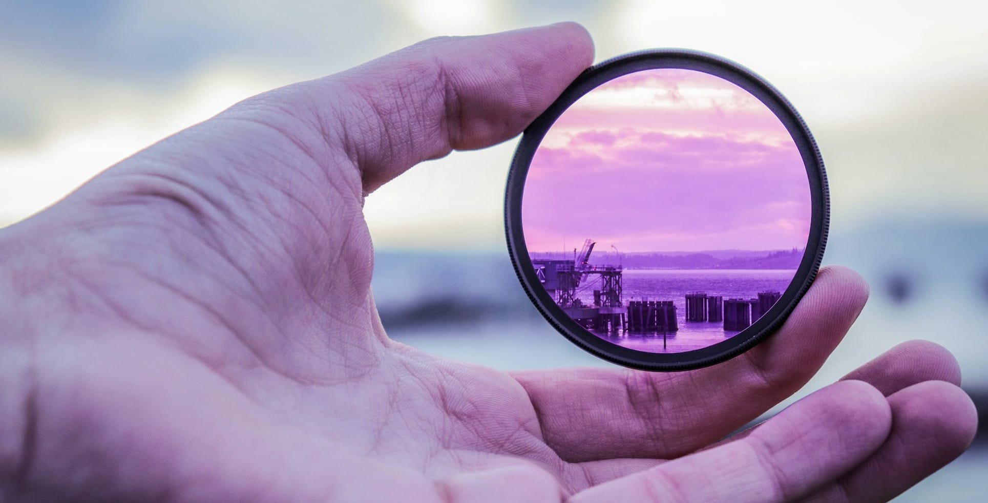 person holding lens