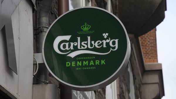 Carlsberg hebt Prognose trotz schwachem Halbjahr an: Britvic-Übernahme zahlt sich schneller aus als geplant
