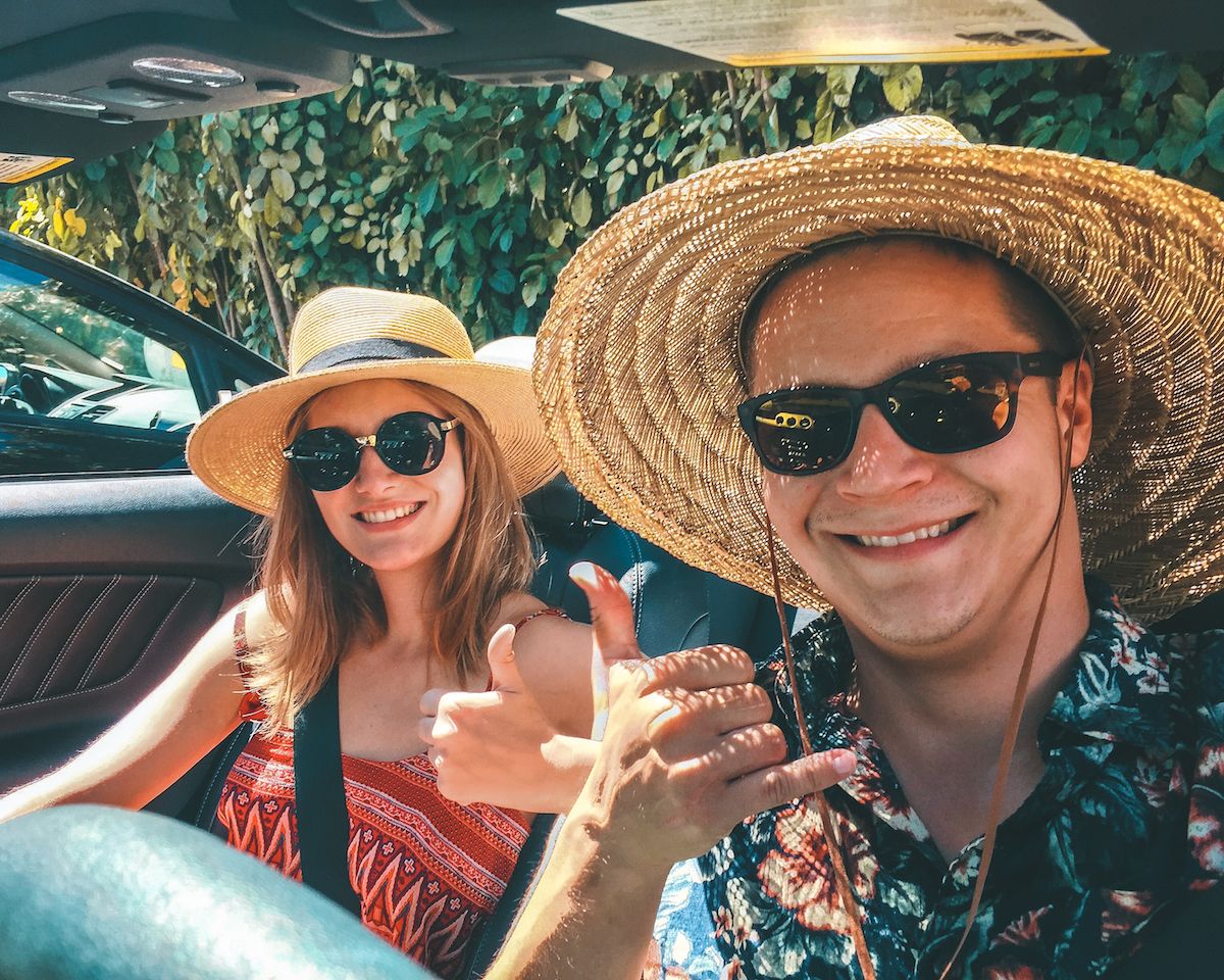 Cec and Ari cruising around Maui in a convertible on one of their first trips together