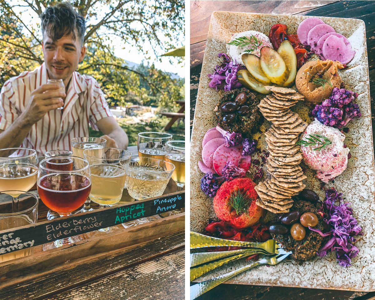 A friend sampling ciders at Salt Spring Wild Cider House, alongside a colourful charcuterie board with dips and crackers.