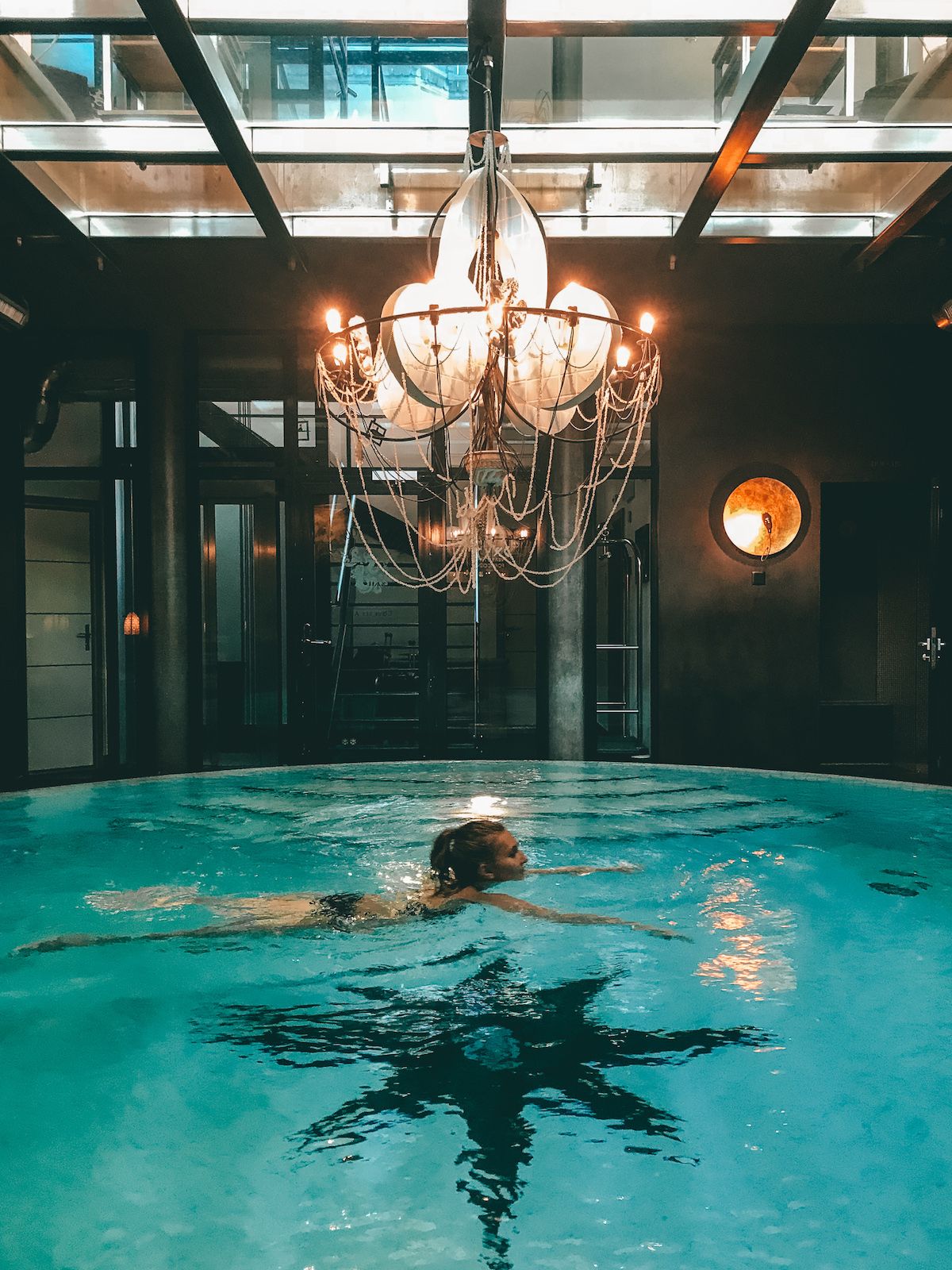 Cecily swimming in a pool at Hotel Coeurs Des Alpes