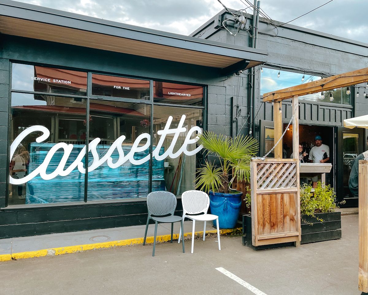 Exterior of Cassette, a trendy Salt Spring Island restaurant, with bold signage reading “Cassette” and an inviting patio setup.