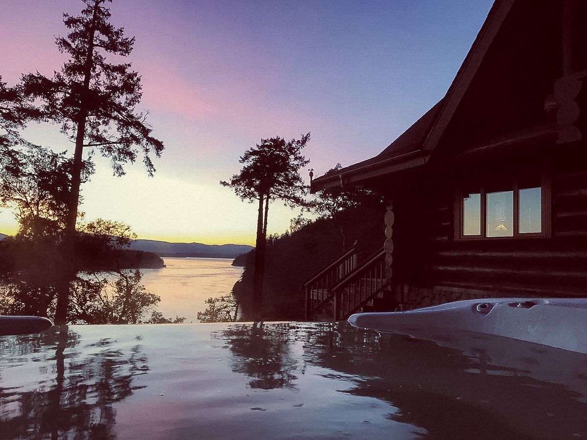 The hot tub at InTheBluff B&B at dusk overlooking the ocean