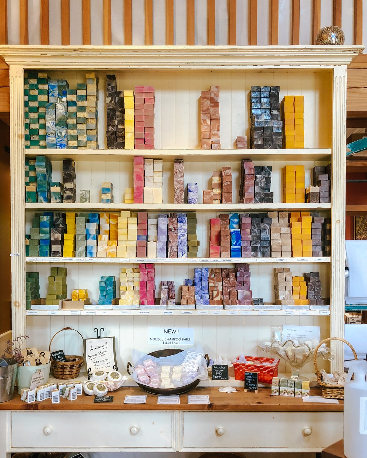  Shelves of colourful handmade soaps at a Galiano Island artisan shop.
