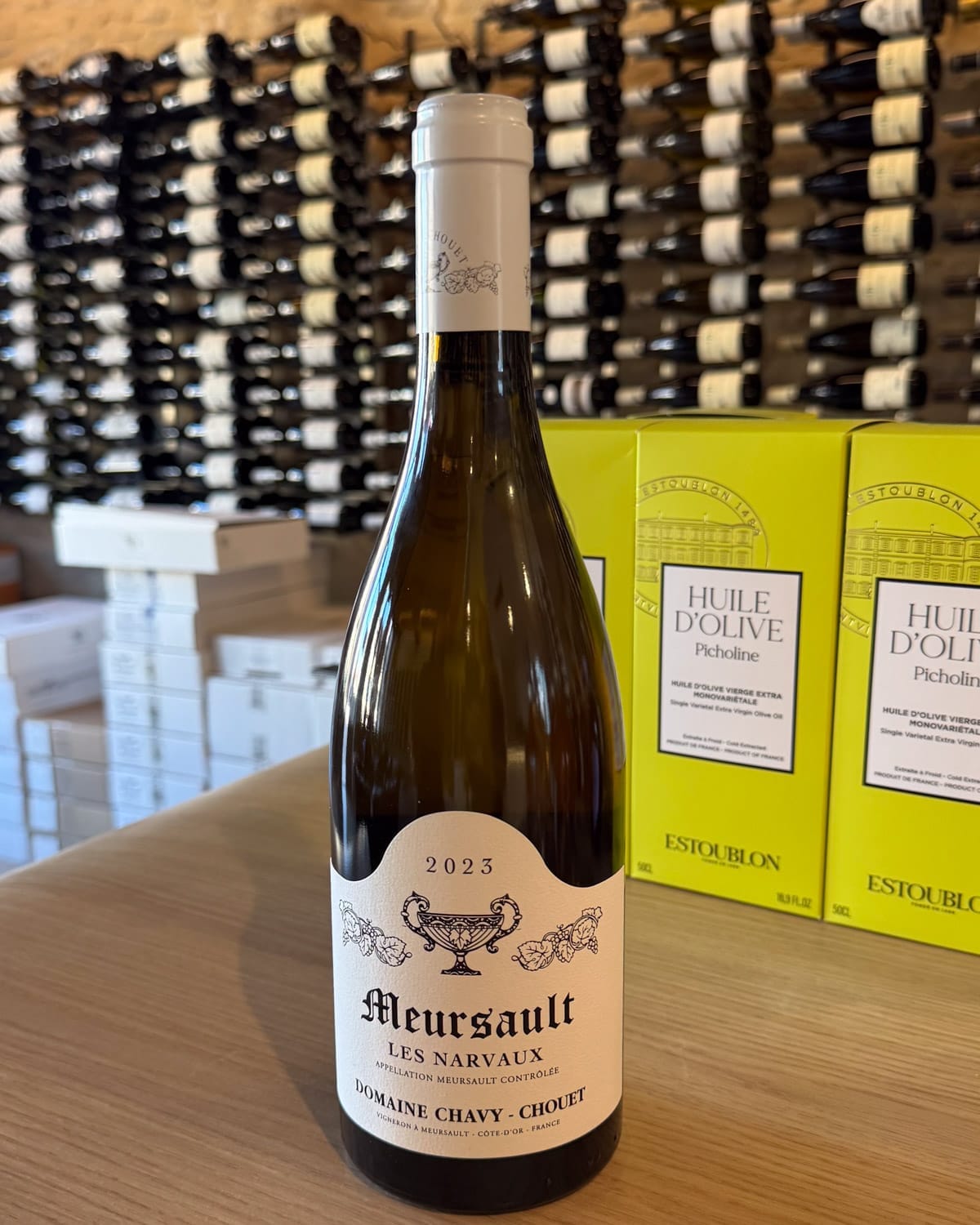 Bottle of Meursault Les Narvaux 2023 by Domaine Chavy-Chouet displayed at La Maison des Vins in Mersault village.