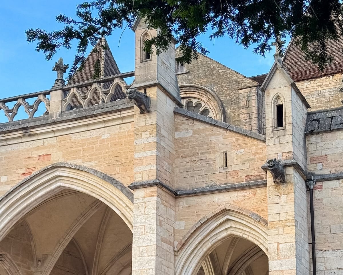 Stone arches and sculpted gargoyles of Basilique Notre-Dame de Beaune.