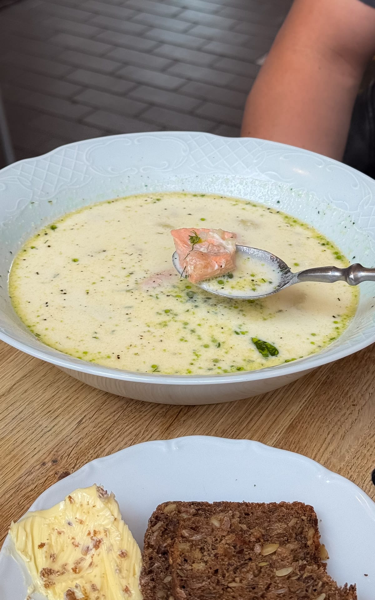 Traditional Finnish salmon soup with dill oil and rye bread served at Story in Old Market Hall.