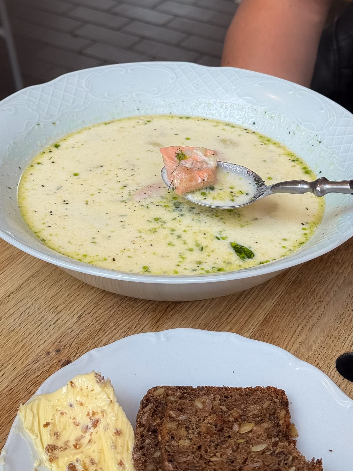 Traditional Finnish salmon soup with dill oil and rye bread served at Story in Old Market Hall.