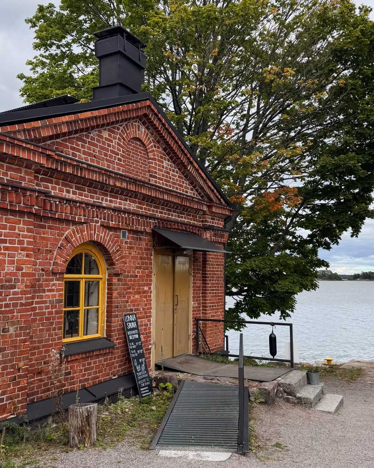 Red brick building at Lonna Island sauna overlooking the Baltic Sea near Helsinki.